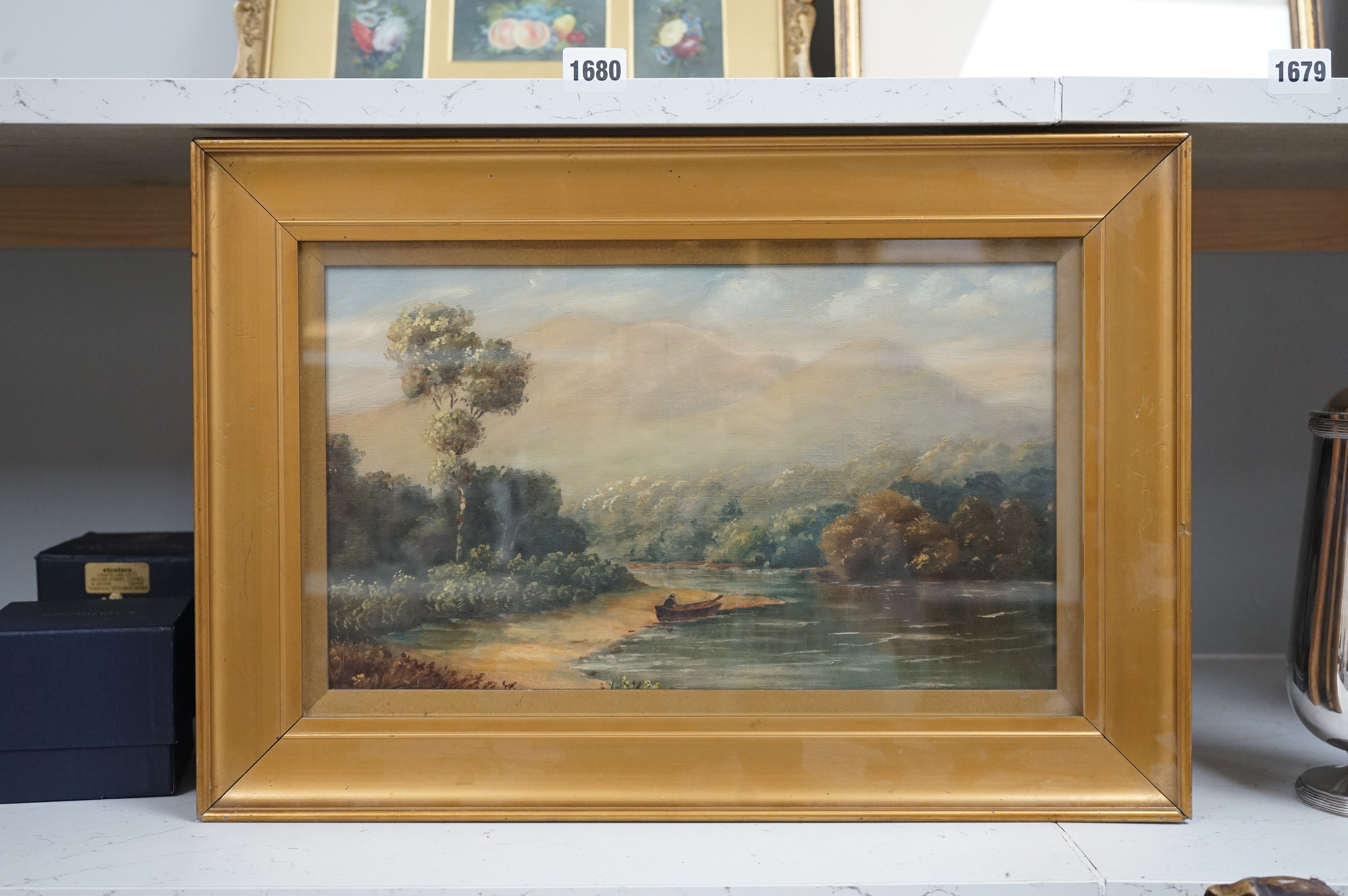 20th century, oil on canvas, Lake scene with fisherman, 22 x 36cm, gilt framed